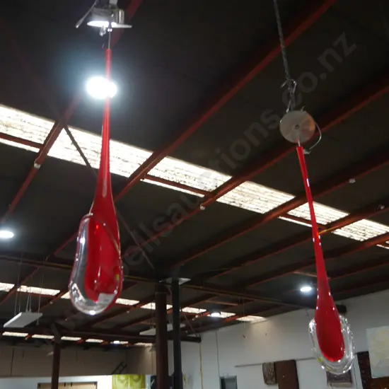 2 red glass pendant lights