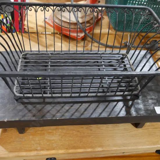 Wrought iron basket and wooden stand