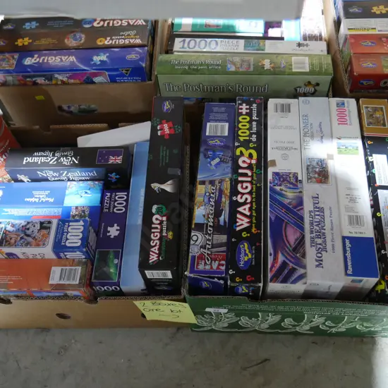 2 boxes of jigsaw puzzles