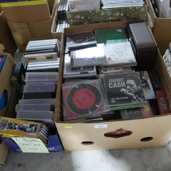 2 boxes of CDs, VHS tapes