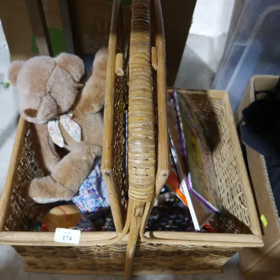 Cane basket, teddy bear, childrens books