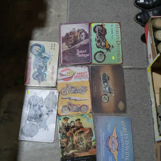 Assorted tin signs