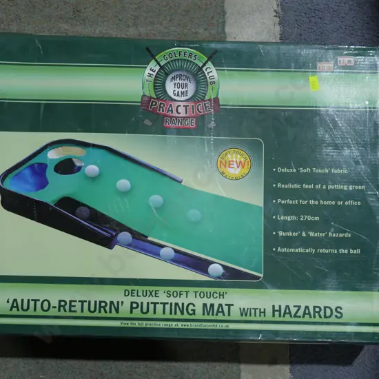 Auto return putting mat
