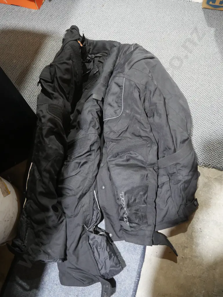 Two boxes of motorcycle clothing Image 1++