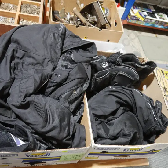 Two boxes of motorcycle clothing