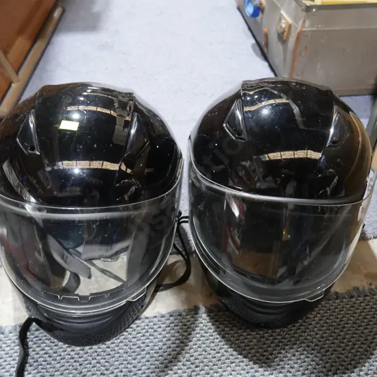 Two motorcycle helmets