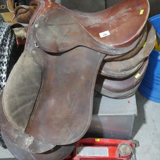 3 horse saddles