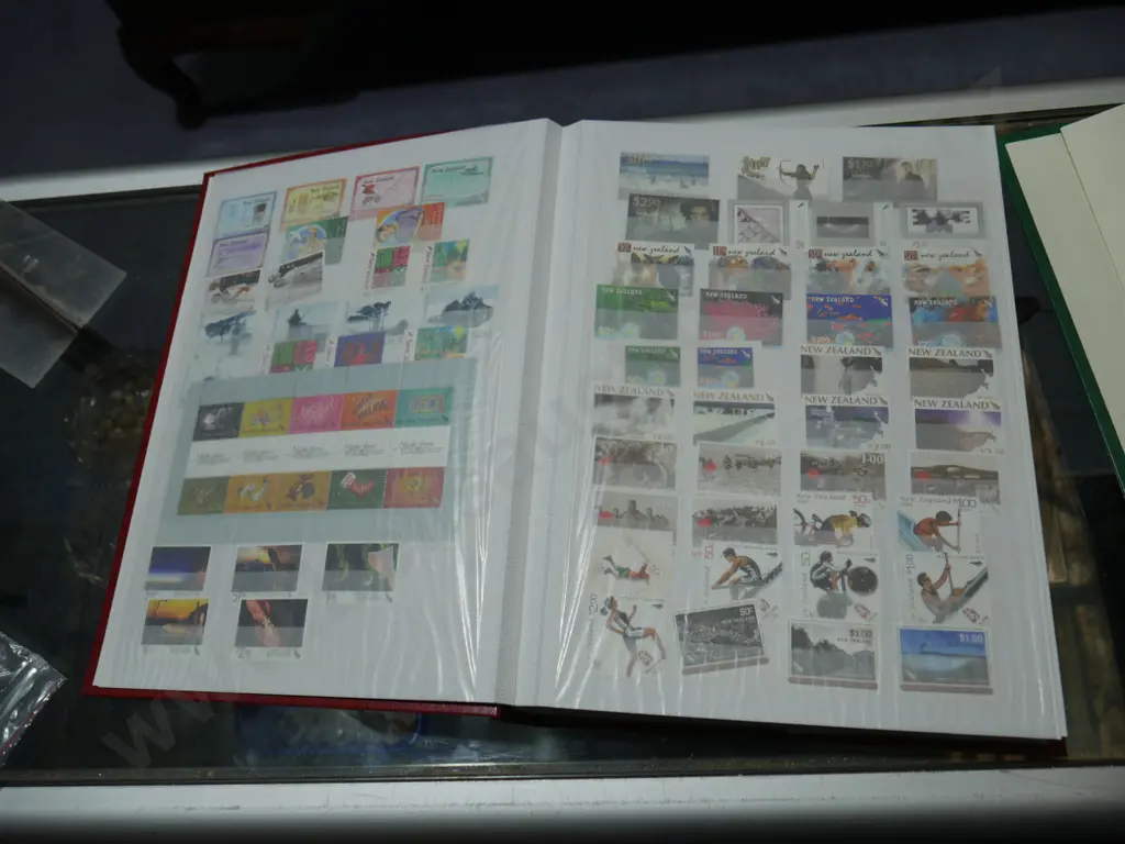 New Zealand stamp album plus empty stamp album Image 1++