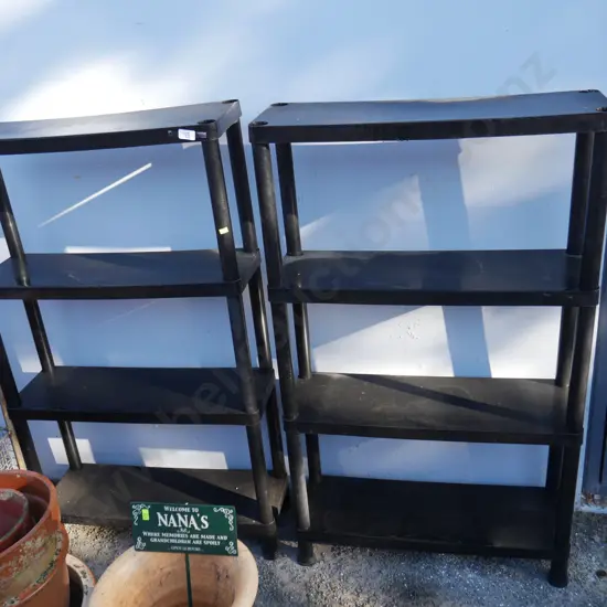 2 black plastic shelves