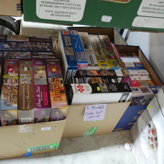 Three boxes of jigsaw puzzles