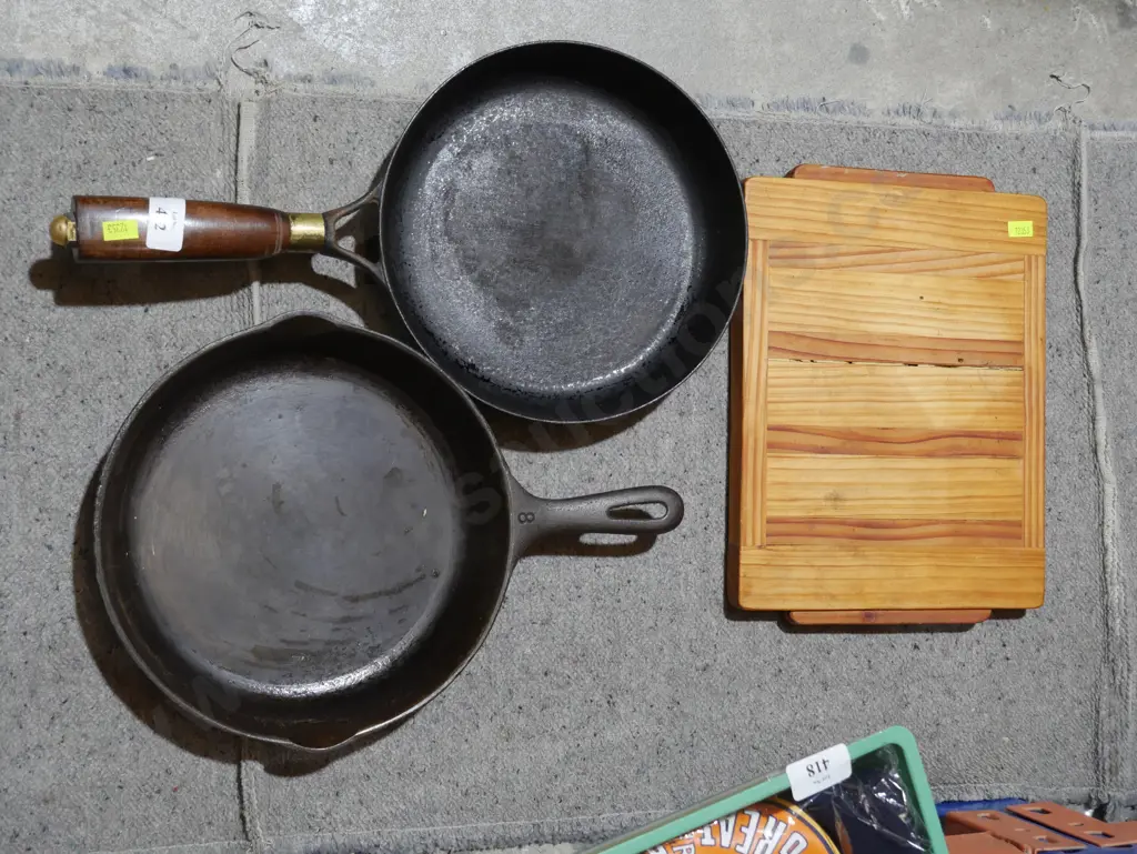 2 cast iron pans and chopping board Image 1++