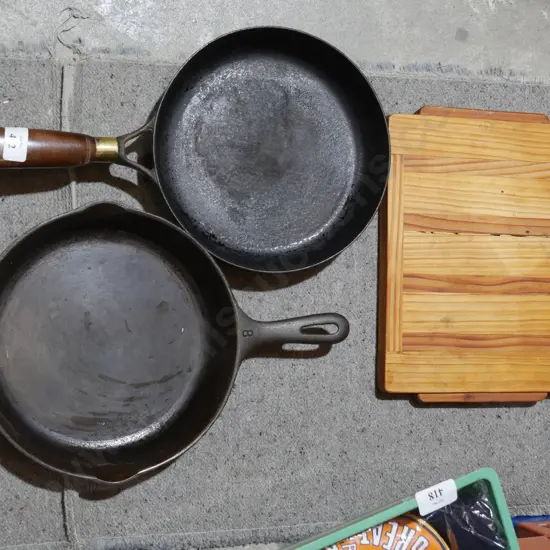 2 cast iron pans and chopping board