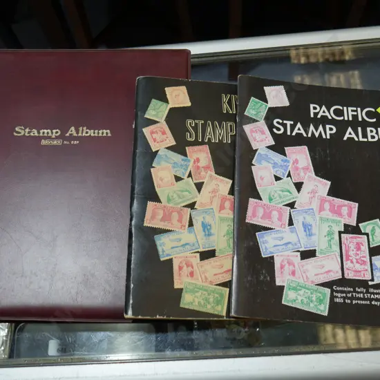 Three stamp albums