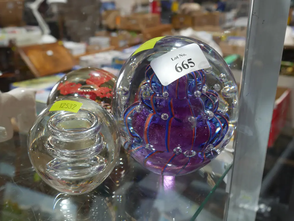 Three glass paper weights Image 1++