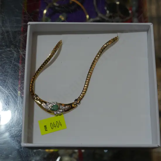 18 carat emerald and Diamond necklace valued at $8500