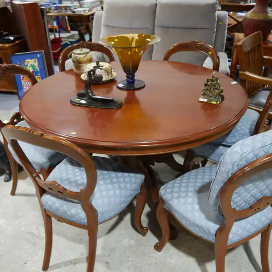 Round dining table and six chairs