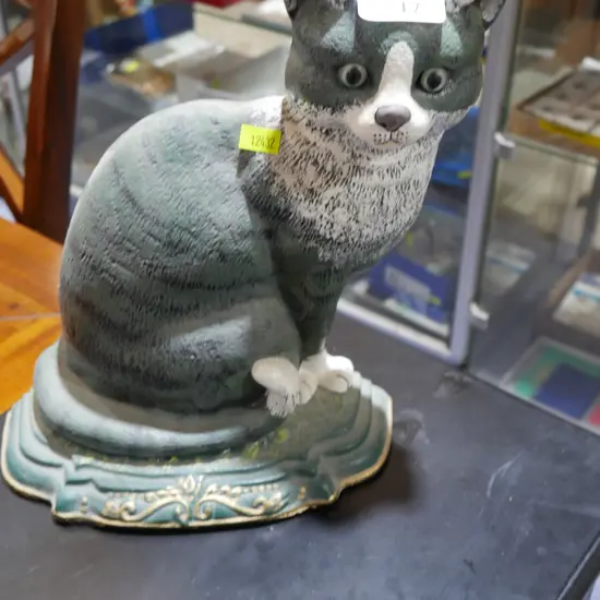 Cast cat door stop