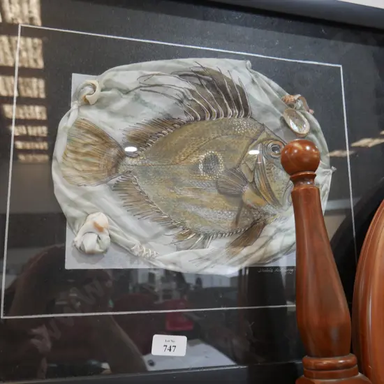 Framed fish artwork on cloth