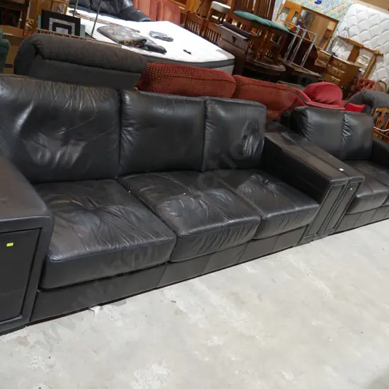 Two black leather couches