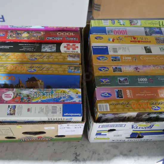 Two boxes of jigsaw puzzles