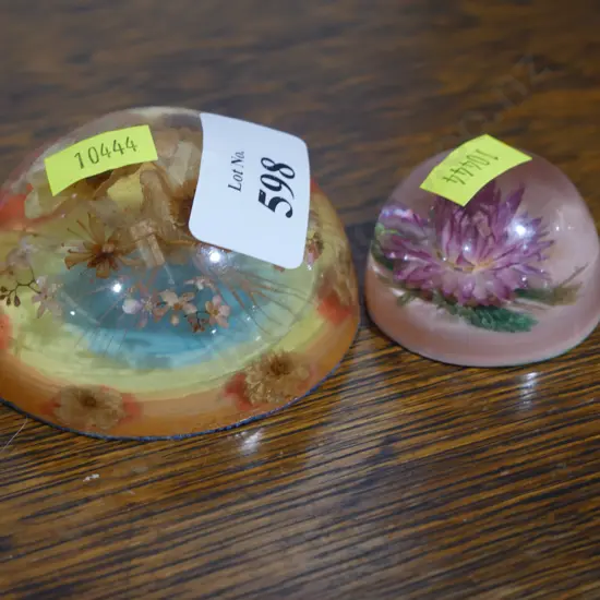 2 risen paperweights