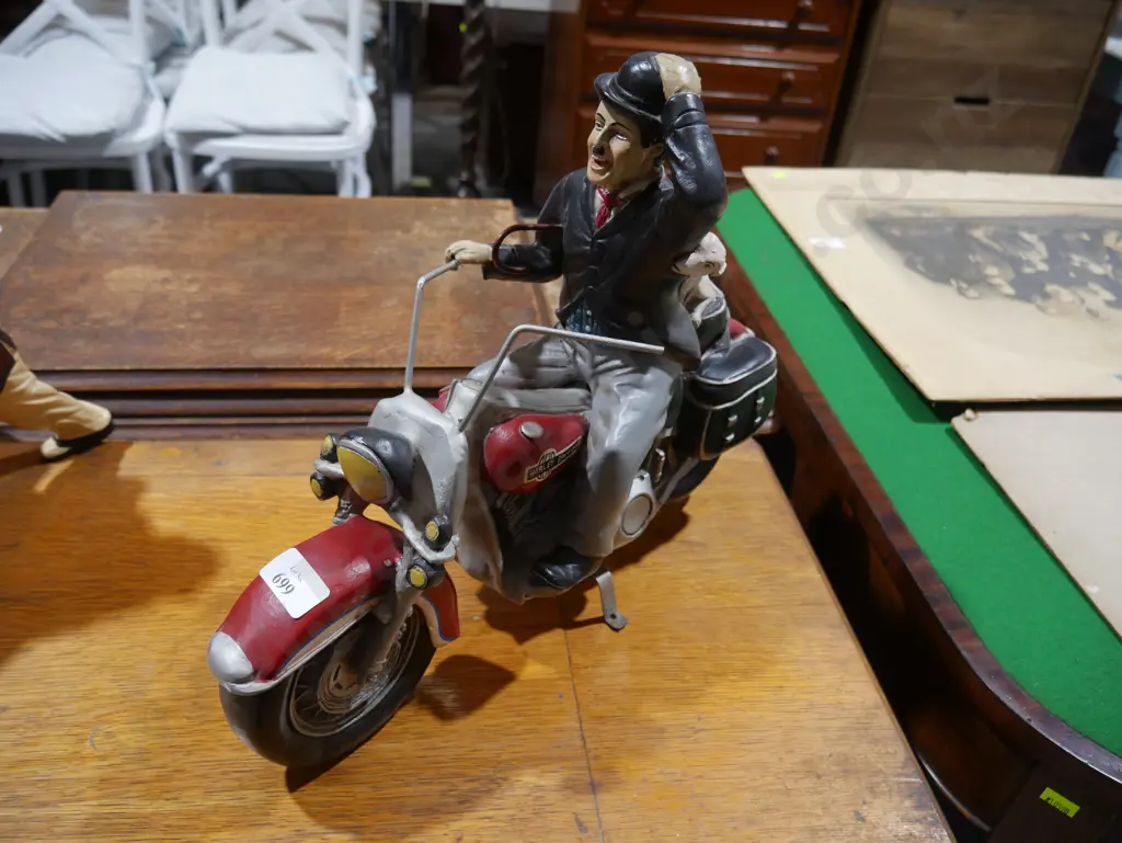 Charlie Chapman on a motorbike Image 1++