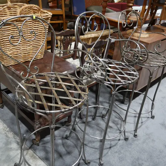 Three metal bar stools