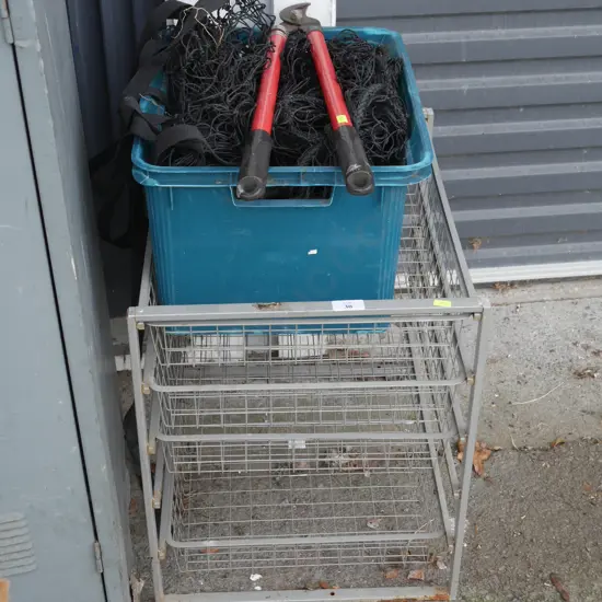 Trailer nets, metal rack, lopper