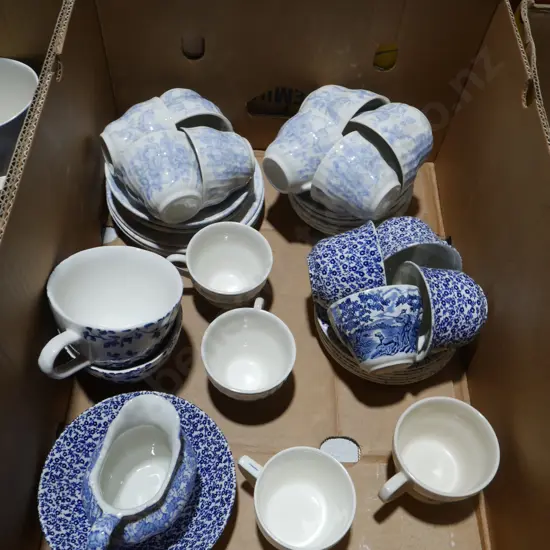 Blue and white cups and saucers