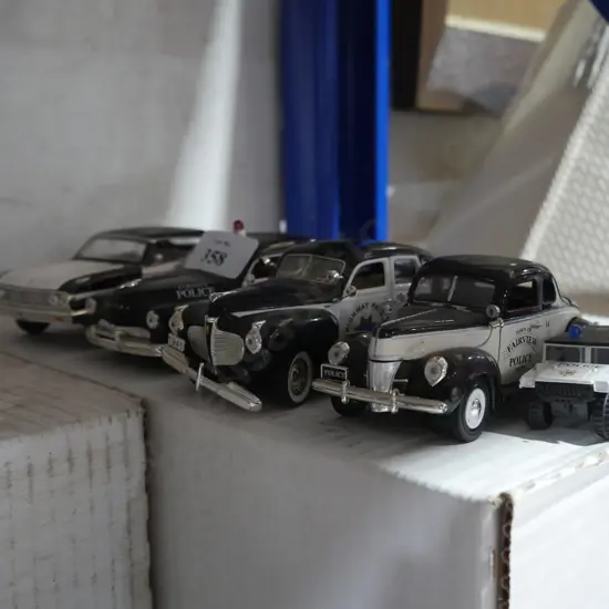5 police vehicles