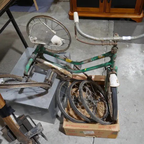 Old tricycle and wheels