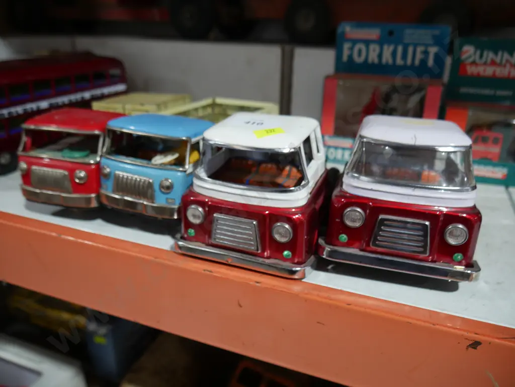 4 tin trucks Image 1++
