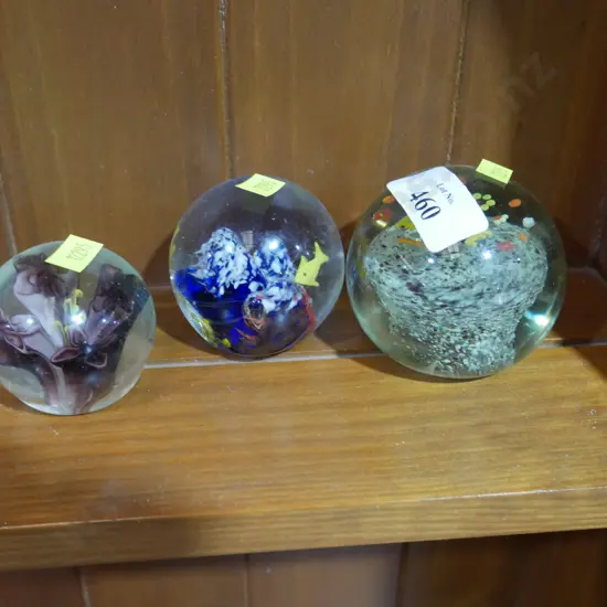 Three glass paper weights