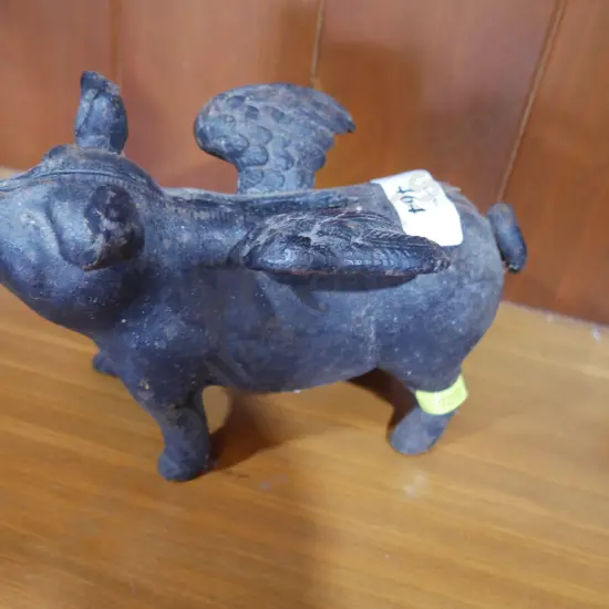 Metal flying pig money box