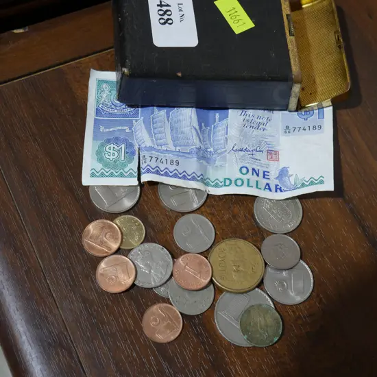 Assorted coins and note