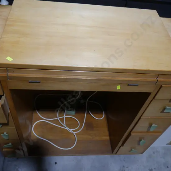 Sewing machine in cabinet
