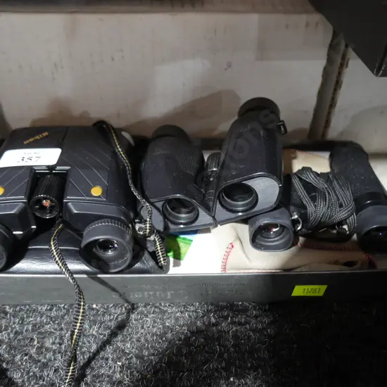 Three pairs of binoculars