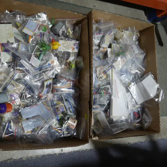 2 boxes of assorted collectible toys