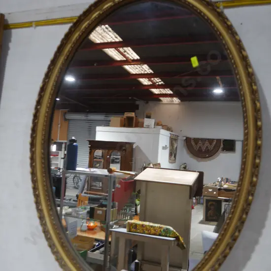 Oval gilt frame wall mirror