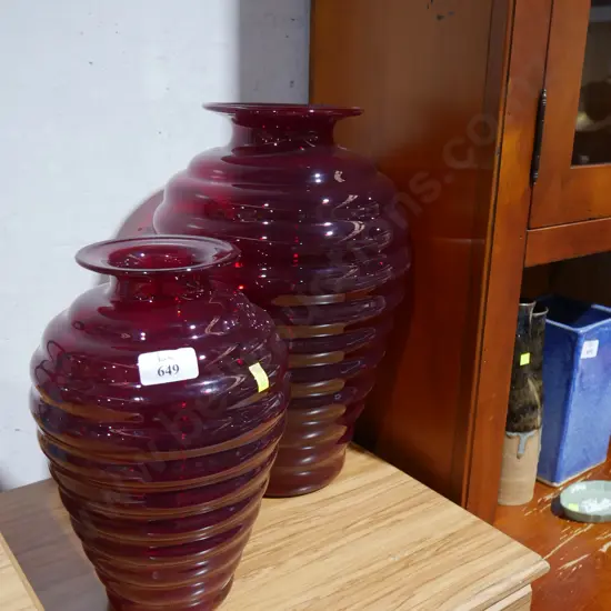 2 red glass vases