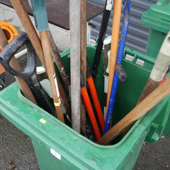 Wheely bin and garden tools