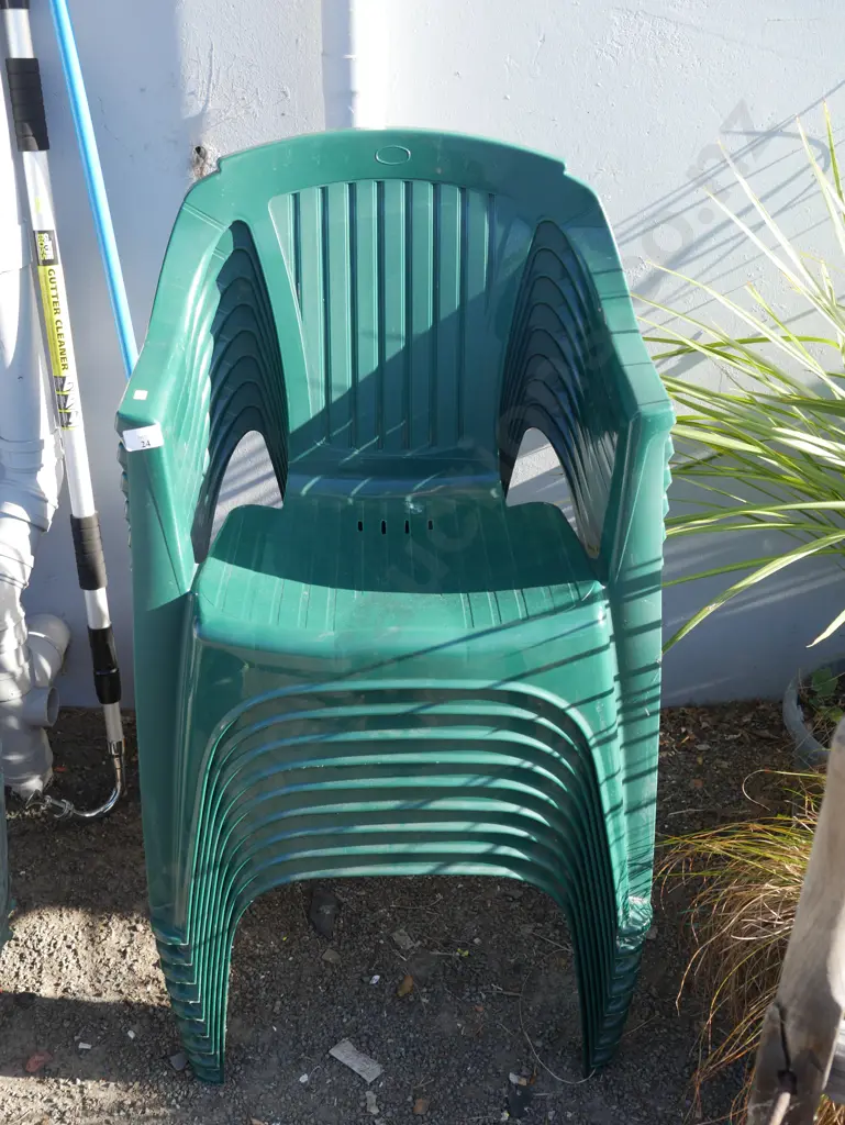 Stack of 9 green plastic chairs Image 1++