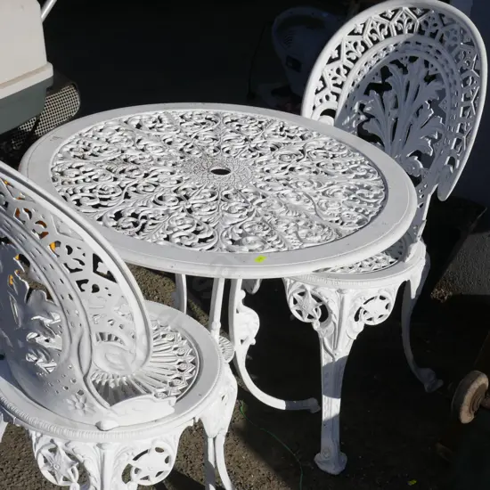 White metal table and 2 chairs