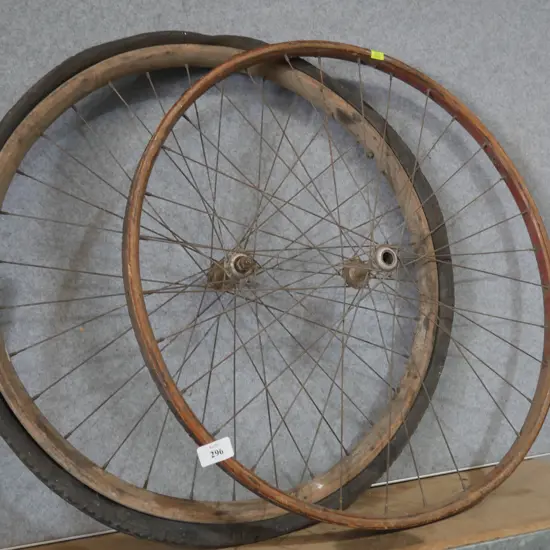 Two old wooden frame bicycle wheels