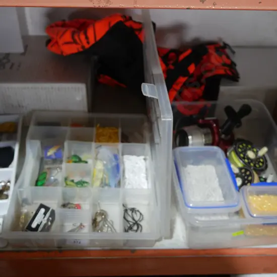 Two boxes of a assorted fishing gear and backpack