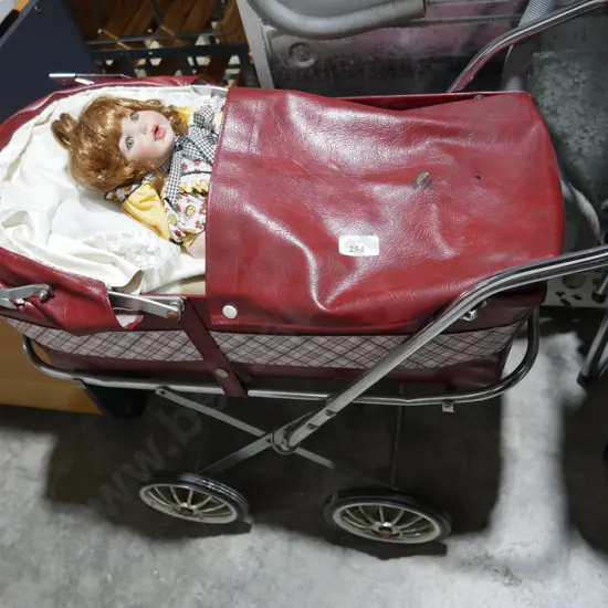 Dolls pram and doll