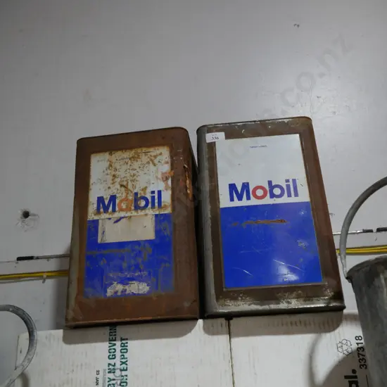 Two Mobil cans