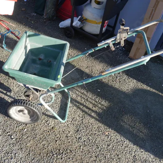 Walk behind seed spreader