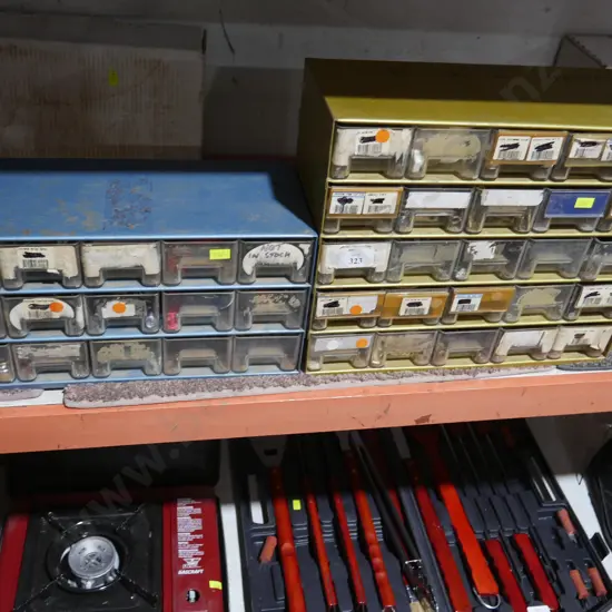 Two sets of storage drawers and contents
