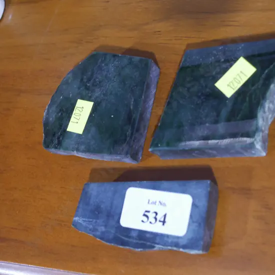 Three pieces of polished stone